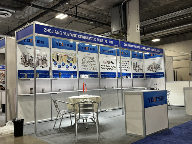 Company Booth Displaying Exhaust Clamps and Flex Pipes at Industry Trade Show