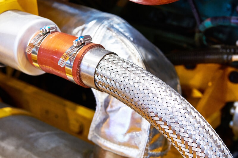 Hose clamps securing a stainless steel braided flexible hose connection